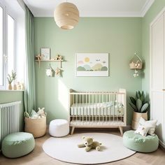 a baby's room with mint green walls and white rugs on the floor