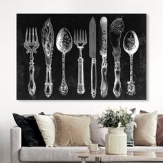 a living room filled with furniture and lots of silverware on top of a blackboard