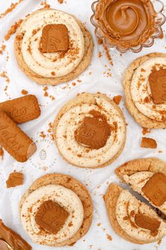 some cookies with frosting and peanut butter on top