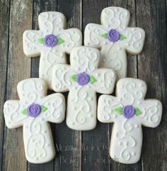 decorated sugar cookies with purple flowers on them