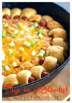 a casserole dish with hot dogs and cheese