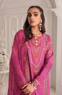 Embroidered Pink Salwar Kameez Trouser Dupatta Dress in Lawn is a mesmerizing masterpiece that steals everyone's hearts at the very first glance. Lavish designs and premium quality of the fabric make this beautiful Pakistani Salwar Kameez an epitome of beauty and your foremost priority. Kameez: The long kameez in an alluring pink color comes in premium lawn fabric. The stunning pink-colored lawn kameez is emblazoned with graceful embroidery and lavish designs. Floral details, threads, and perfec Pink Salwar Kameez, Dupatta Dress, Salwar Kameez Pakistani, Eid Dress, Fuchsia Wedding, Pakistani Salwar Kameez, Eid Dresses, Lawn Fabric, Embroidery Work