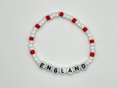 Get ready for Euro 2024 with this beaded bracelet in England's team colours! The perfect way to show your support for the team this summer. Personalise your bracelet with your favourite player's initials and squad number. Makes a great gift for any football fan! Bracelets are 17cm long and made with stretchy elastic cord. All bracelets are made to order and will be dispatched within 3 days by Royal Mail Second Class. Bracelet Inspo, England Football, Beaded Crafts, Bracelet Ideas, Team Colors, Beaded Bracelet, Royal Mail, This Summer, Initials