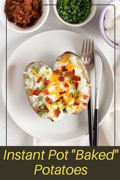 a white plate topped with an open heart shaped egg next to bowls of vegetables and meat