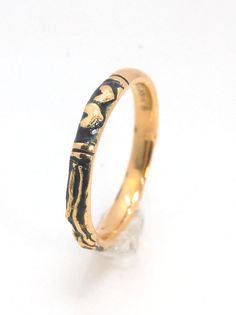 This is the most narrow of my Memento Mori rings at 3mm wide and is cast in 14k rich yellow gold. The Skeleton is flanked by intertwined hearts on one side.14k rich yellow gold and EnamelMade to Order. Usually ships in 3-5 days.This ring looks great as part of a stack, as a wedding band, a right-hand ring, or a promise ring, and all by its damn self, thank you very much. And as always, my rings are Unisex. Y’all wear what you want!I made these Memento Mori rings for my older sister Jill, a famou Hand Forged Gold Engraved Promise Ring, Hand Forged 14k Gold Engraved Promise Ring, Hand Forged Yellow Gold Engraved Promise Ring, Hand Forged Yellow Gold Engraved Ring For Anniversary, Hand-forged Yellow Gold Engraved Ring For Anniversary, 14k Gold Hand Forged Engraved Ring For Anniversary, Hand Forged 14k Gold Engraved Ring For Anniversary, Anniversary Hand Forged 14k Gold Engraved Ring, Yellow Gold Stackable Promise Rings In Recycled Gold