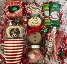 a basket filled with candy, marshmallows and other holiday treats