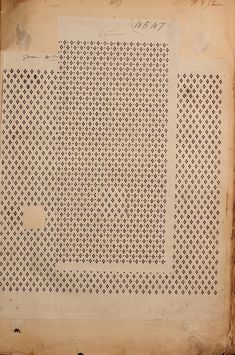 an old piece of paper with holes in it