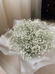 a bouquet of baby's breath on a table