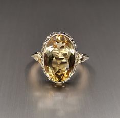 Beautiful 1950s vintage silver citrine ring, US Size 6 3/4, in good vintage condition. Box on the photos not included! Diameter: approx. 17 mm (0.7 inch) Material: 925 silver (gold plated), citrine total weight: 4.0 g US Size: approx. 6 3/4 (EU size 54 1/2) A stunning religious shop well worth a visit ... https://etsy.me/2NNNK4g Art Deco 14k Gold Topaz Ring For Formal Occasions, Gold Art Deco Topaz Ring For Anniversary, 14k Gold Art Deco Topaz Ring For Formal Occasions, Retro Formal Rings With Polished Finish, Retro Rings With Polished Finish For Formal Occasions, Gold Topaz Art Deco Ring For Anniversary, Retro Polished Rings For Formal Events, Formal Art Deco 14k Gold Topaz Ring, Art Deco 14k Gold Topaz Ring