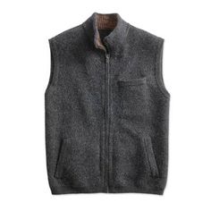 Boiled wool has a long history in outerwear made for life in the European Alps. This men's charcoal grey travel vest translates that tradition to the South American Andes using a soft baby alpaca wool blend for a lightweight naturally water- and wind-resistant garment. The zip-front vest features two front slash pockets and a chest pocket. Gray Winter Vest With Pockets, Casual Wool Vest, Black Wool Vest Outerwear, Casual Wool Vest Outerwear, Travel Vest, Fall Wear, Clothing And Textile, Fashion Boho, Wool Vest