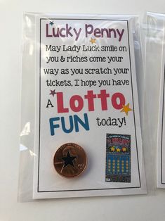 two lucky penny magnets are sitting on top of a white card with the words lucky penny