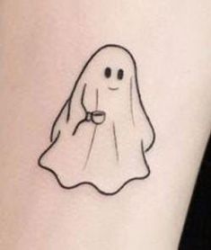 a small ghost tattoo on the ankle