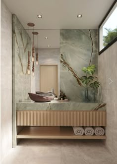 a bathroom with marble walls and flooring next to a sink in the middle of it