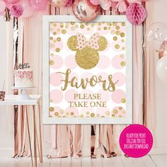 a pink and gold minnie mouse party backdrop