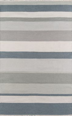 a rug with grey and white stripes on it