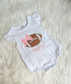 This listing is for a white bubble ruffle romper with a football and name embroidered on it. This bubble romper is adorable.  If you want different colors message me. I am happy to change to meet your needs.  Thank you for stopping by my shop!! White Bubble Romper With Ruffles And Short Sleeves, White Ruffled Onesie For Playtime, White Ruffled Onesie For Playwear, Cute White Onesie With Ruffles, Cute White Ruffled Onesie, White Short Sleeve Bubble Romper For Playwear, Playful White Short Sleeve Bubble Romper, White Playful Short Sleeve Bubble Romper, White Short Sleeve Onesie For Game Day