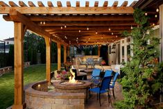 an outdoor patio with fire pit and seating area