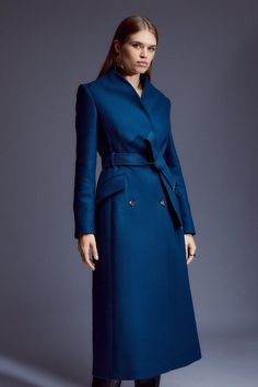 Crafted From Italian Wool For Timeless Elegance, This Midi Coat Has A Sculpting Silhouette That Is Formed By A Stand Collar With Contemporary With Notched Details, A Belted Waist, And Flap Pockets. Pair This Piece With Layers Of Cosy Cashmere And Wool Knitwear For Season-Long Styling.Stand Collarflap Pocketsself-Tie Beltmidi Length Chic Pea Coat With Stand Collar For Workwear, Classic Wool Coat With Self Belt For Work, Formal Belted Wool Coat With Notch Lapel, Formal Wool Coat With Belted Cuffs And Notch Lapel, Office Wool Coat With Notch Lapel And Belted Cuffs, Chic Belted Pea Coat With Notch Lapel, Luxury Belted Wool Coat With Notch Lapel, Formal Double-breasted Wool Coat With Belted Cuffs, Luxury Wool Coat With Belted Cuffs For Office