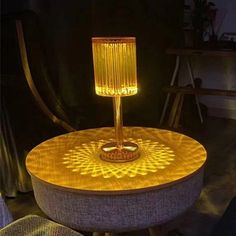 a table with a lamp on top of it in the shape of a sunflower