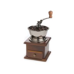 a coffee grinder with beans in it on top of a wooden stand and a white background