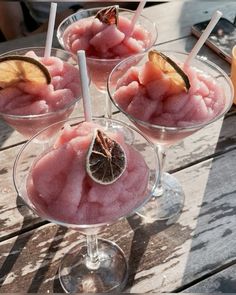 three glasses filled with ice cream and fruit