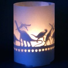 a lit up paper lantern with animals on it