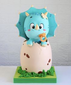 a cake shaped like an elephant in an egg shell