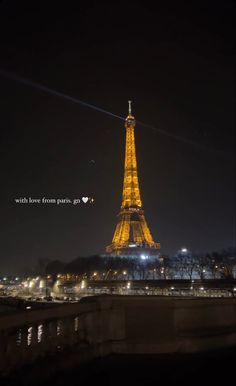 the eiffel tower lit up at night with love from paris written on it