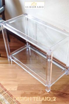 a clear table sitting on top of a hard wood floor