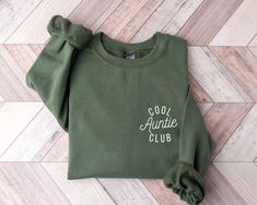 "Cool Aunties Club Sweatshirt and Hoodie, Cool Aunt Sweatshirt, Aunt Gift, Aunt Birthday Gift, Sister Gift, Auntie Sweatshirt,Aunt Sweatshirt This shirt has a hand pressed design. It has a very soft touch that you will feel comfortable for a long day. HOW TO ORDER ** Check and Review all Photos. ** Select your item's Size and Color from drop down menus. ** Choose the Quantity you want. ** Provide personalization in personalization box if offered.(name, print color etc.) ** Click ADD TO CART. And, you can go back to add more product color for your family members or you can complete the checkout process. ** Please Click \"Proceed to Check Out\" ** Finally, Your order will be ready to ship 1 - 3 Business Day. Due to the nature of the fabric as well as your monitor or mobile screen colors may Auntie Sweatshirt, Birthday Gift Sister, Aunt Sweatshirt, Aunt Birthday Gift, Aunt Birthday, Cool Aunt, Heat Press Printing, Gift Sister, Club Sweatshirts