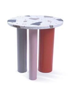 two different colored stools sitting next to each other in front of a white background