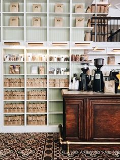 a coffee shop with lots of boxes on the shelves