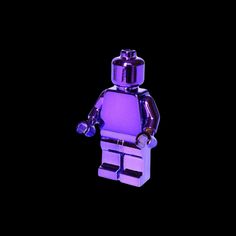 a purple lego figurine is shown against a black background