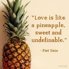 a pineapple sitting on top of a wooden table next to a quote from the book love is like a pineapple, sweet and undeffiable