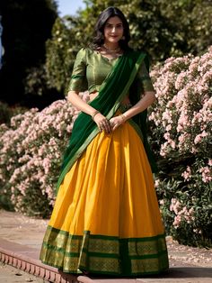 Introducing our stunning great yellow zari weaving kanchipuram silk function wear lehenga choli! This exquisite ensemble features a yellow color Kanchipuram silk lehenga with intricate zari weaving work, paired with a matching green color Kanchipuram silk choli also adorned with zari weaving work. Completing the look is a green color georgette plain dupatta with intricate lace borderwork.
The lehenga is beautifully stitched up to 42 inches in length, with a 3.70-meter flair, while the choli come Kanchipuram Lehenga, South Indian Culture, Fashion Lehenga, Zip Stitching, Lehenga Choli Designs, Lehenga Crop Top, Half Saree Lehenga, Lehenga Fabric, Yellow Lehenga