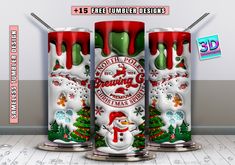 three red and white cans with christmas decorations on them, sitting in front of a wall