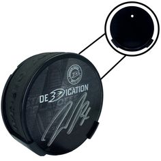 the hockey puck has been signed by the team's goalie, and is attached to