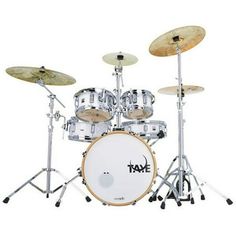 a white drum set with three drums on it