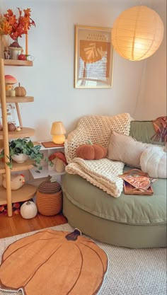 a living room filled with lots of furniture and decor on top of a hard wood floor