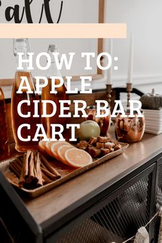 an apple cider bar cart with apples, oranges and cinnamon