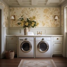 a washer and dryer in a room with floral wallpaper on the walls