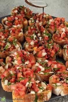 a platter filled with lots of food on top of a table