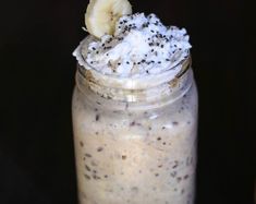 a banana and chia seed shake in a mason jar with whipped cream on top