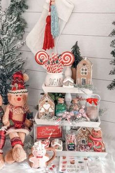 two teddy bears sitting next to each other in front of christmas decorations