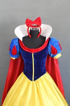 snow white dress with red cape and yellow skirt