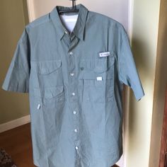 Columbia Polo Shirt Pfg Size Small New Without Tags Mesh Lined Short Sleeve 4 Front Pocket With Velcro Button Front Shoulder To Shoulder 20” Armpit To Armpit 23” Sleeve 10” Length 31” 100 % Cotton Khaki Button-up Top For Outdoor, Casual Long Sleeve Camp Shirt With Button Closure, Khaki Buttoned Tops For Outdoor, Short Sleeve Camp Shirt With Button Closure For Outdoor, Outdoor Camp Shirt With Button Closure And Short Sleeves, Outdoor Camp Shirt With Short Sleeves, Cotton Button-up Camp Shirt For Outdoor, Short Sleeve Khaki Shirt With Buttons, Khaki Short Sleeve Button-up Shirt