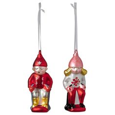 two christmas ornaments hanging from strings on a white background