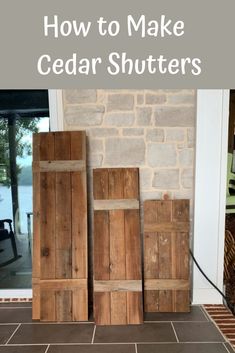 three wooden shutters sitting on top of a tile floor