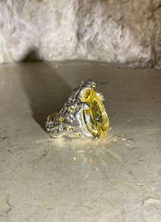 This Custom Molten Canary Stone Ring is made by hand in Los Angeles. No two rings are alike. They are made with solid sterling silver and an assortment of yellow and clear stones throughout each side of the ring. Each ring has a clear heart shape stone engraved on the inside. This is a statement piece made with love. 925 Sterling Silver and Canary Pear Cut Certified CZ Stones Made in LA This item its handmade* please allow 2-4 weeks after your order is placed for production time. Luxury Citrine Ring With Large Stone, Luxury Large Stone Citrine Ring, Double Cross Ring, Luxury Handmade Citrine Ring, Blue Heart Ring, Luxury Multi-stone Citrine Rings, Luxury Citrine Multi-stone Rings, Clear Heart, Pink Stone Rings