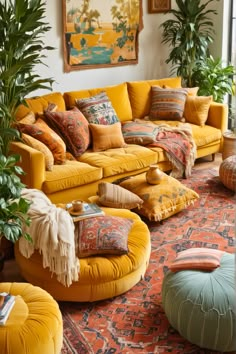 a living room filled with yellow couches and lots of pillows on top of them